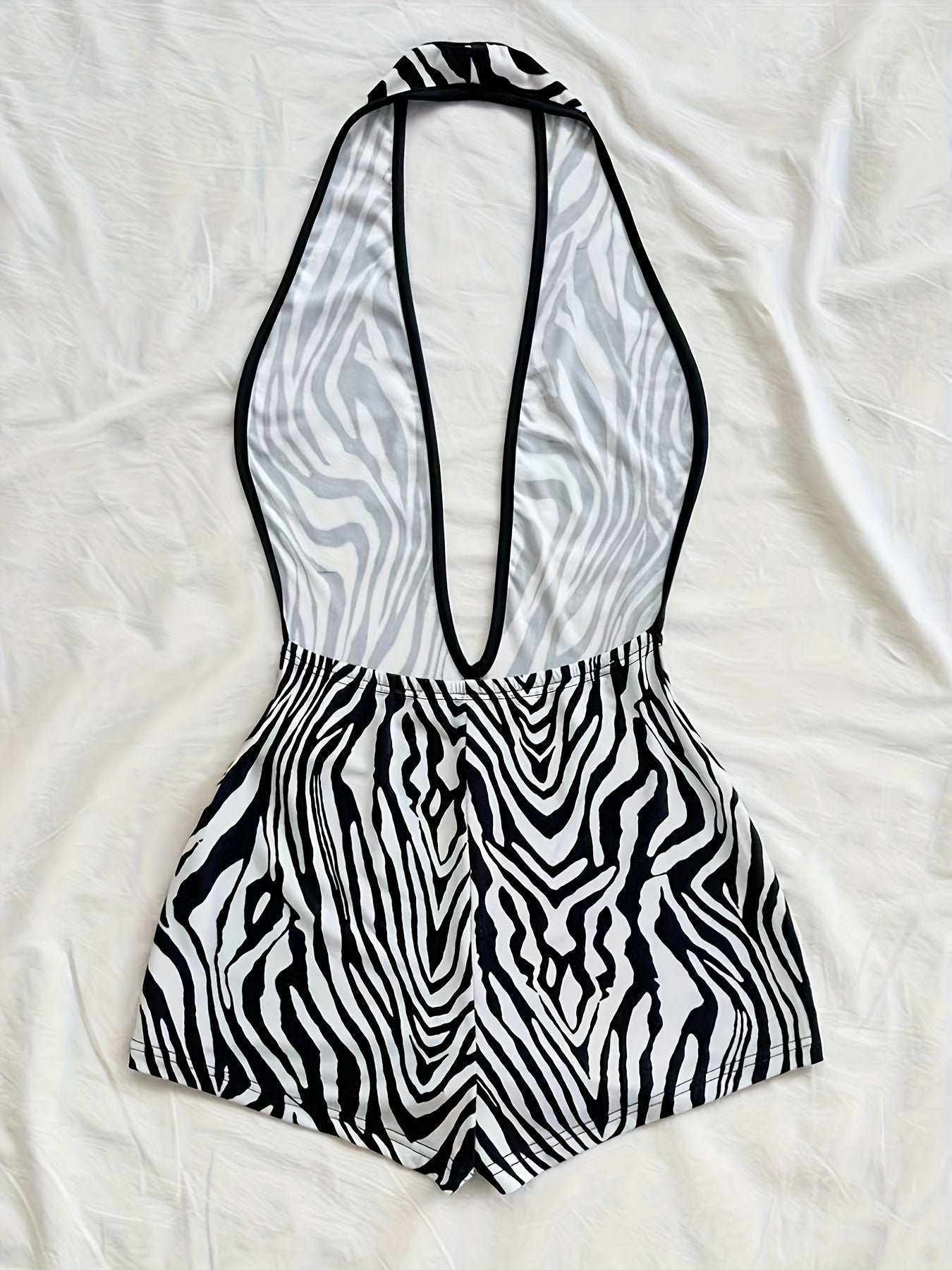 Damen Jumpsuit mit tiefem Ausschnitt und Animalprint – Trendiger Einteiler für Party, Strand & Urlaub